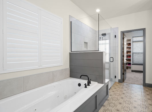 Palm Beach Polysatin Vinyl Shutter closed in bathroom
