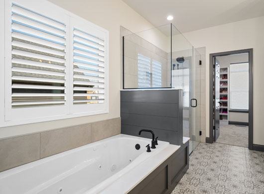 Palm Beach Polysatin Vinyl Shutters Tilted in Bathroom